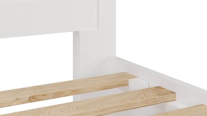 Grace Four Drawer Platform Storage Bed in Snowfall White — close-up of the slats and side rail