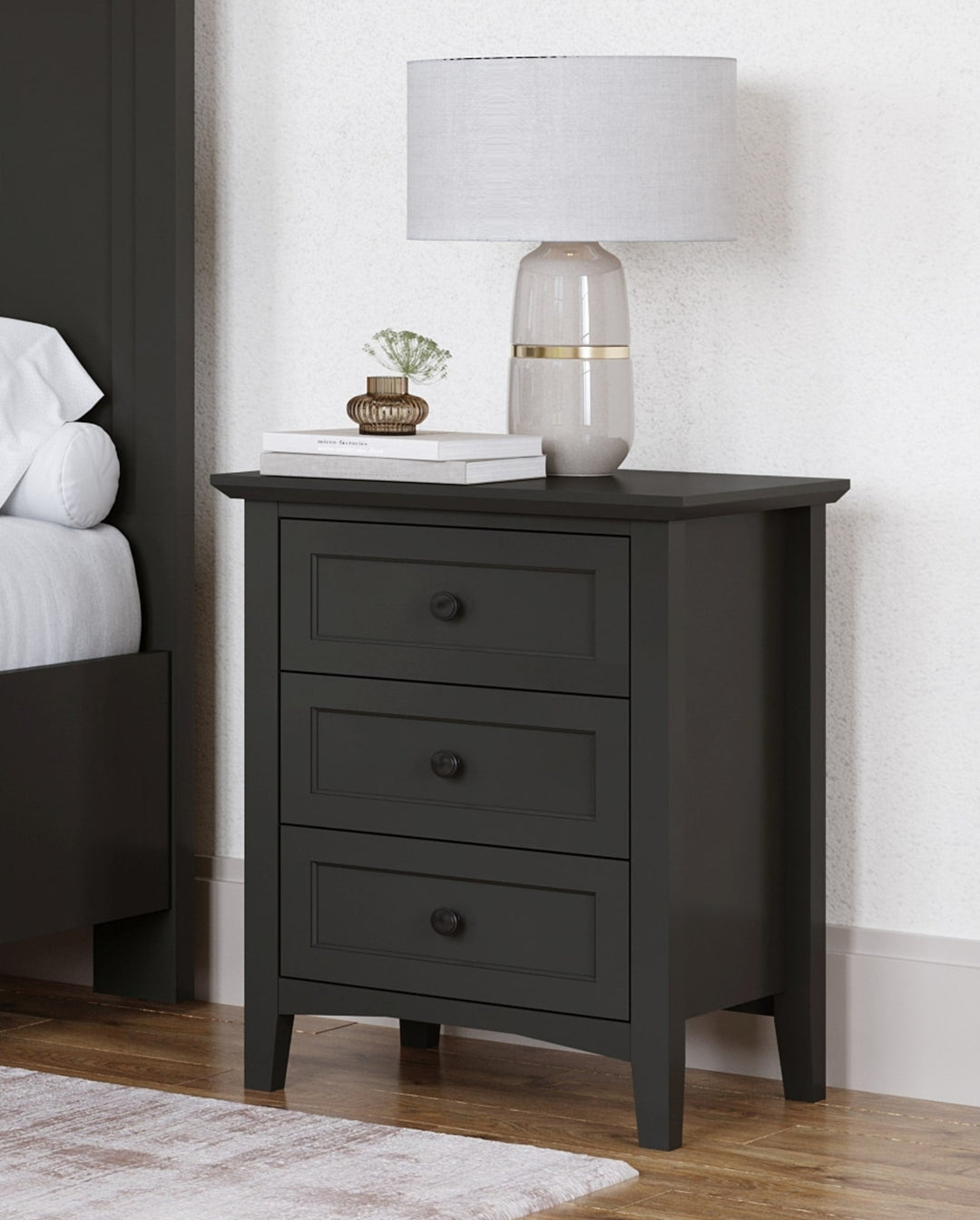 Grace Three Drawer Nightstand in Raven Black — in a bedroom setting