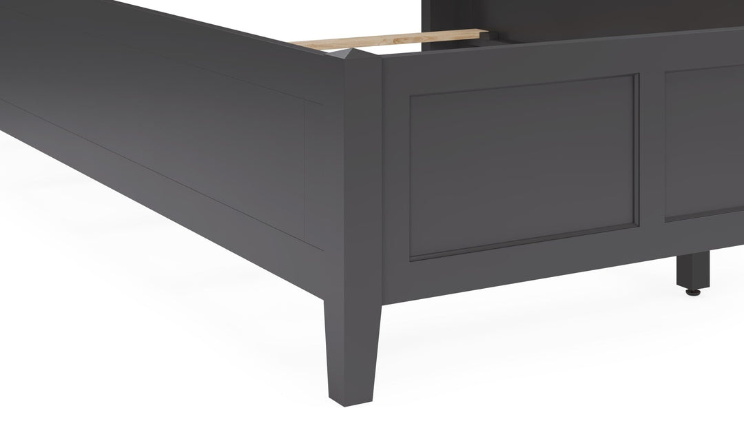 Grace Three Panel Bed in Raven Black — close-up of the footboard and leg