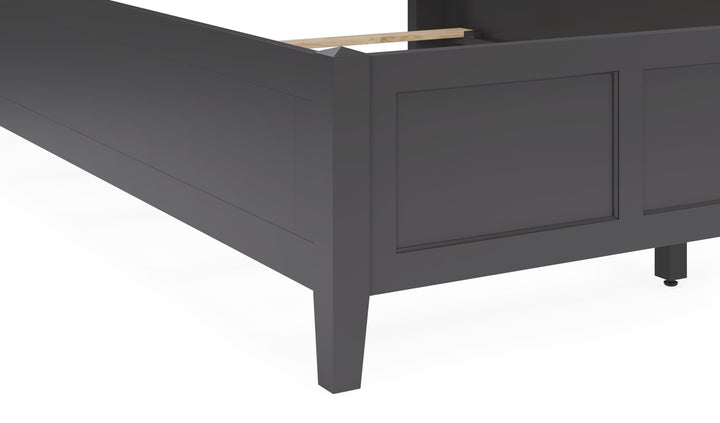 Grace Three Panel Bed in Raven Black — close-up of the footboard and leg
