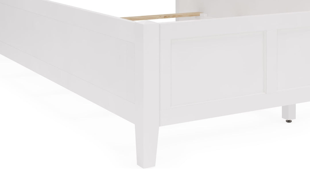 Grace Three Panel Bed in Snowfall White — close-up of the footboard and leg
