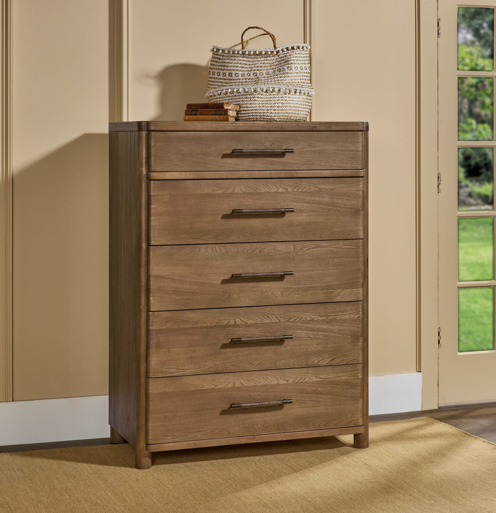 Hollis Five Drawer Chest in Cabin Glow — styled in a room