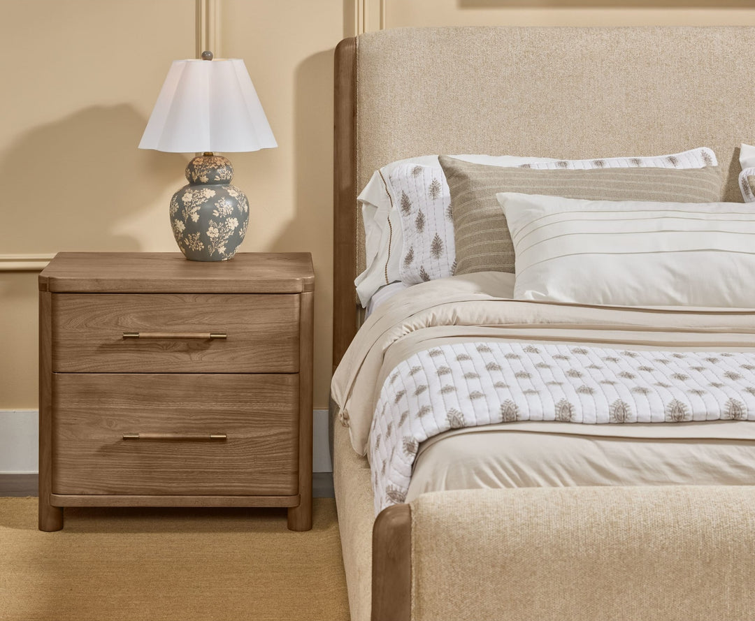 Hollis Two Drawer Nightstand with Cord Management in Cabin Glow — in a bedroom setting