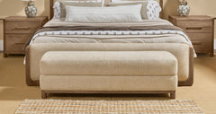 Hollis Upholstered Bench by Modus in Cabin Glow — in a bedroom setting