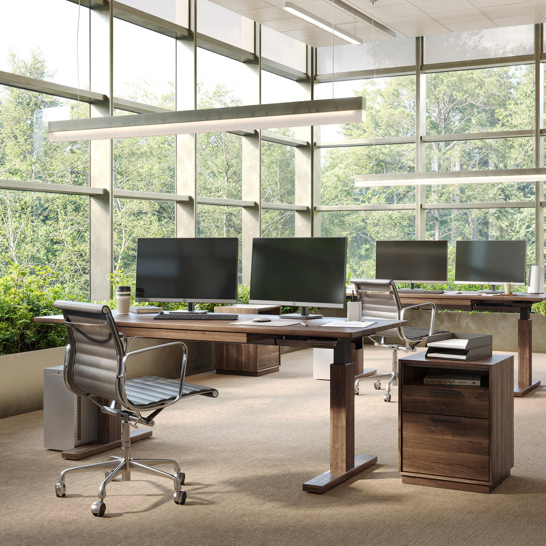 Invigo Sit-Stand Desk by Copeland Furniture in a modern interior