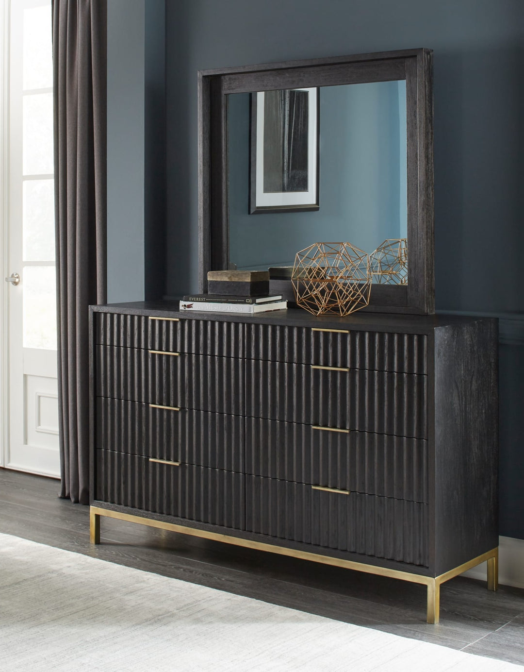 Kentfield Eight Drawer Dresser in Black Drifted Oak — styled with the matching mirror (sold separately)