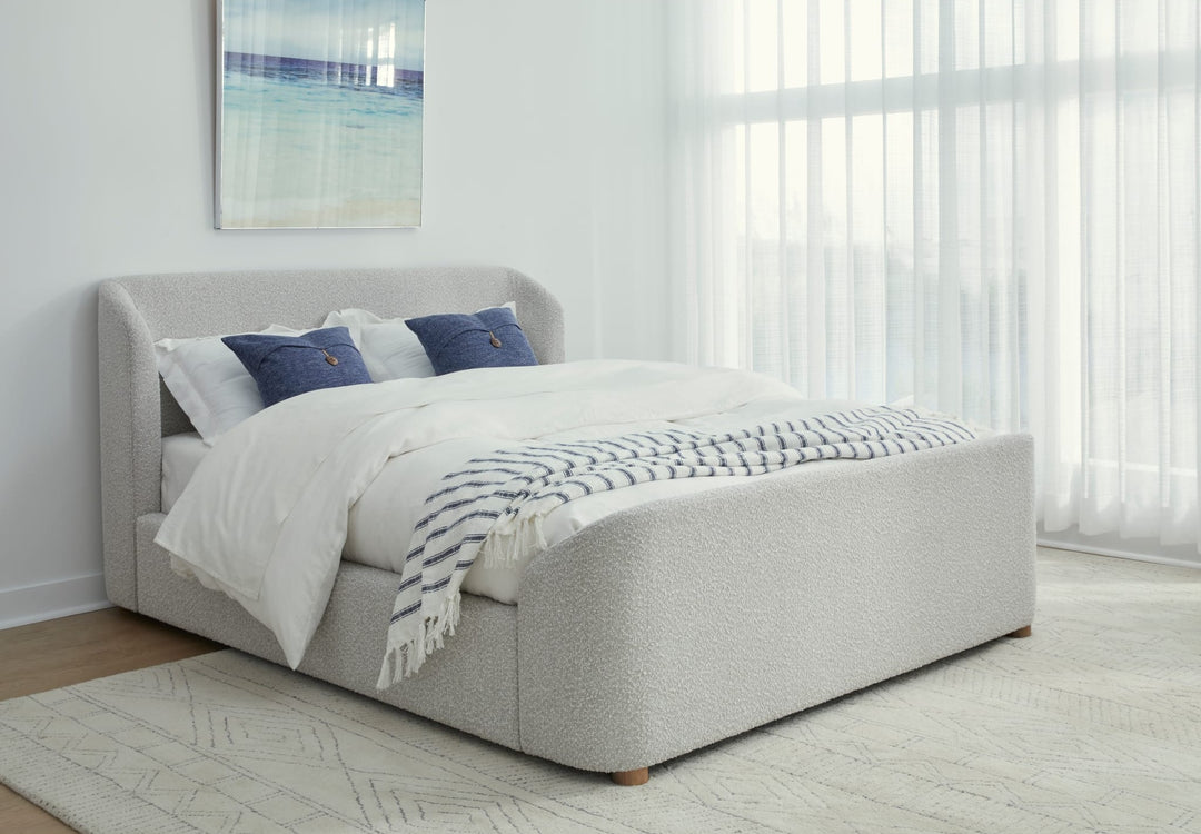 Kiki Upholstered Platform Bed in Cotton Ball Boucle styled in a bedroom