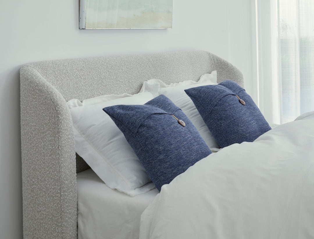 Kiki Upholstered Platform Bed in Cotton Ball Boucle styled in a bedroom