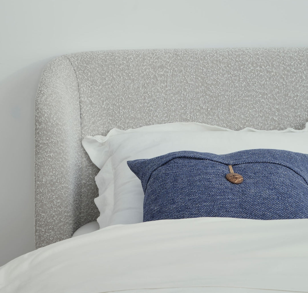 Kiki Upholstered Platform Bed in Cotton Ball Boucle — close-up of the boucle headboard