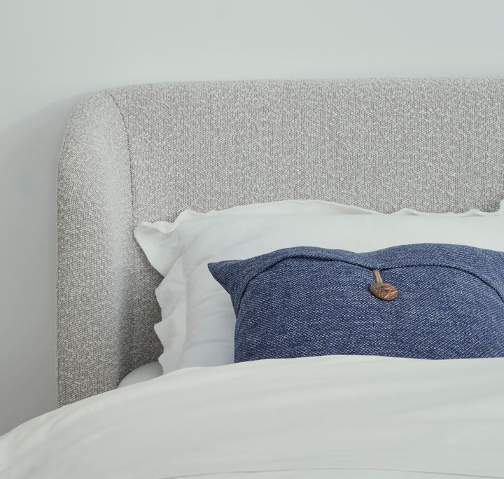 Kiki Upholstered Platform Bed in Cotton Ball Boucle — close-up of the boucle headboard