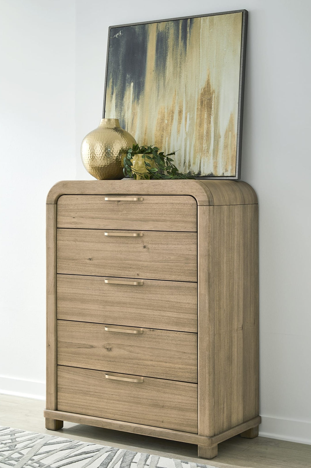 Kione Five Drawer Chest in Lioness — styled in a room