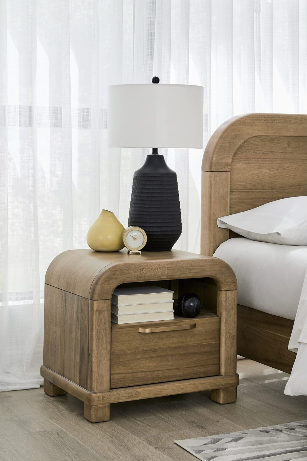Kione One Drawer Nightstand in Lioness — in a bedroom setting