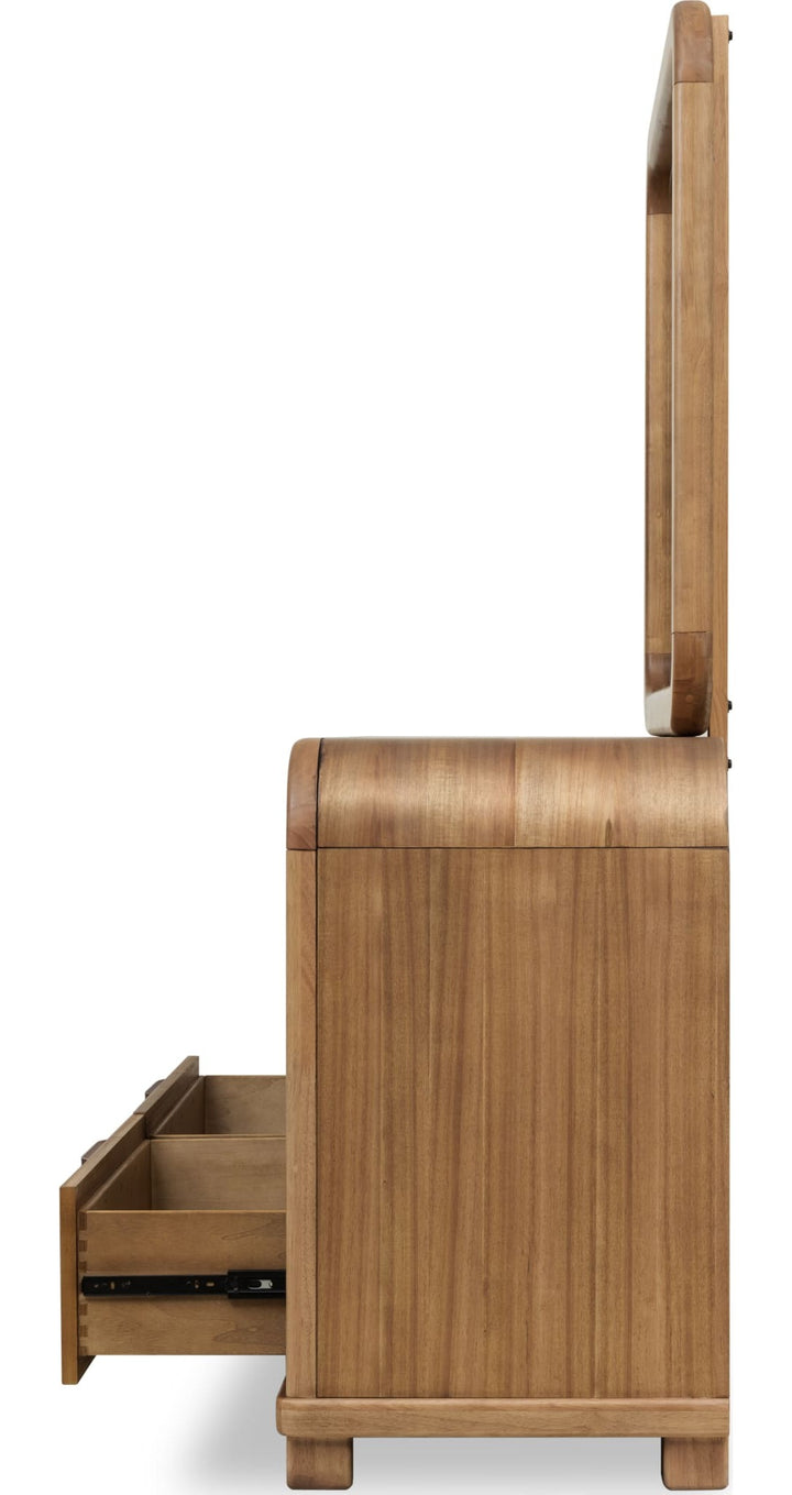 Kione Six Drawer Dresser in Lioness — side view with the matching mirror (sold separately)