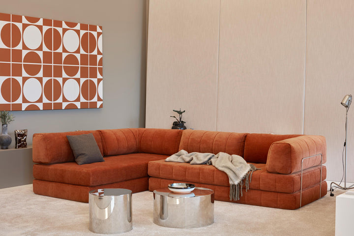 CozyPad Sleeper Sofa L-Shape with arm by Innovation Living in rust orange velvet as an L-shaped sofa with a throw and chrome side tables