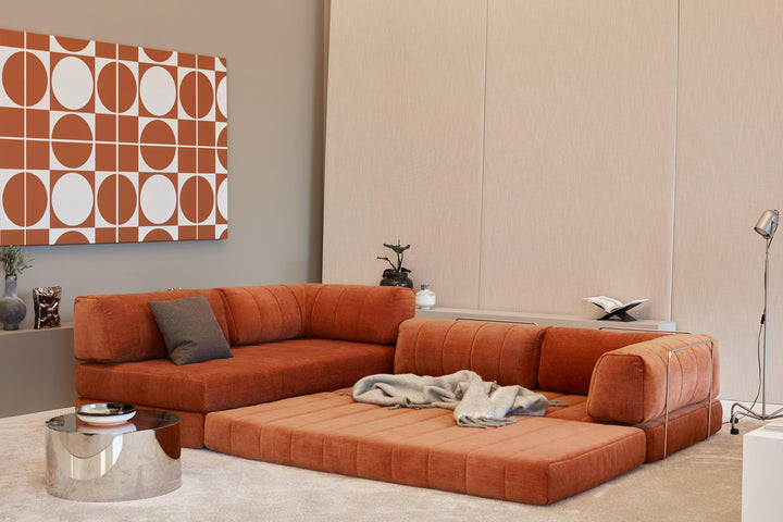 CozyPad Sleeper Sofa L-Shape with arm by Innovation Living in rust orange velvet with the chaise opened as a lounge and a grey throw