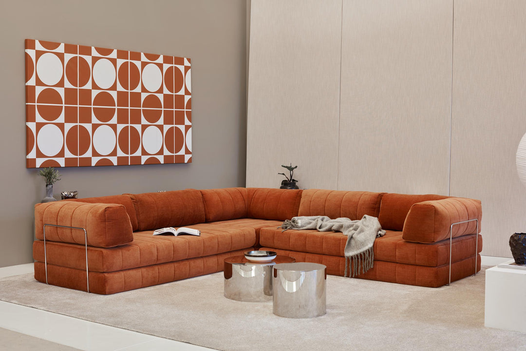 CozyPad Sleeper Sofa Corner with arms by Innovation Living in rust orange velvet as a corner sofa with a throw and chrome side tables