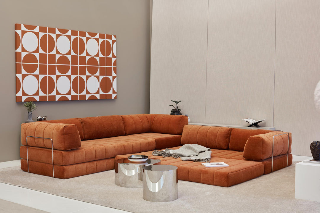 CozyPad Sleeper Sofa Corner with arms by Innovation Living in rust orange velvet with the corner opened as a lounge beside chrome side tables