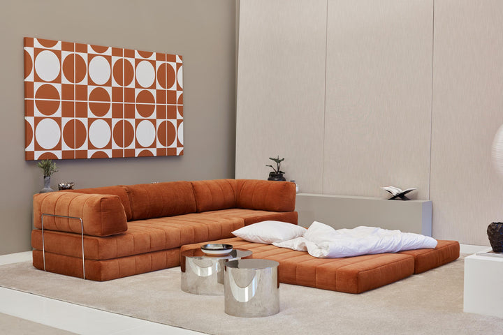 CozyPad Sleeper Sofa Corner with arms by Innovation Living in rust orange velvet partly made up as a bed with white bedding