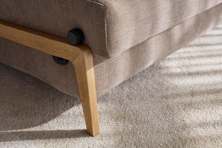 Cubed Sleeper Sofa with Wood Legs by Innovation Living close-up of the oak leg and grey upholstery
