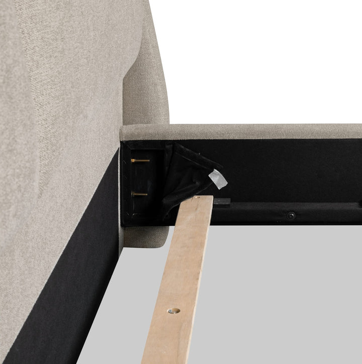 Langford Upholstered Bed in Moondust — close-up of the side rail bracket