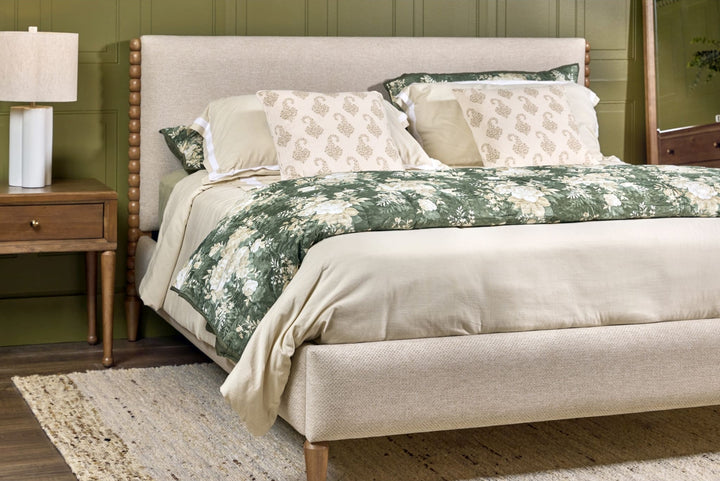 Langley Upholstered Bed styled in a bedroom
