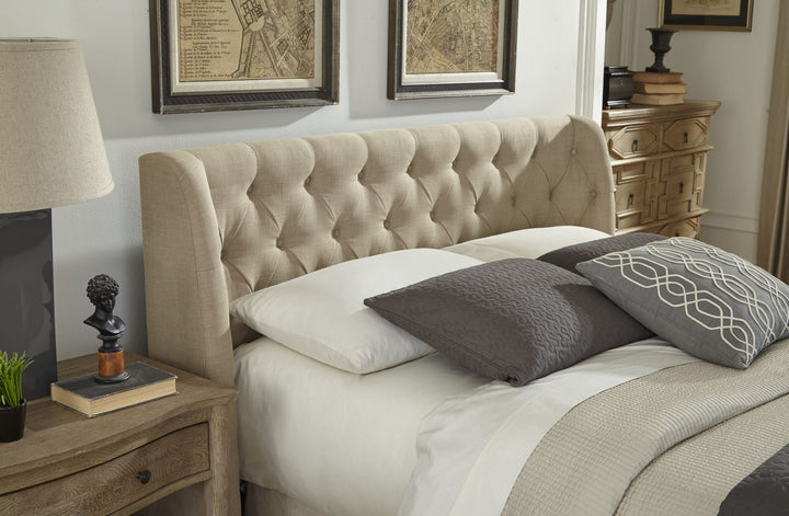 Levi Tufted Upholstered Footboard Storage Bed in Toast Linen styled in a bedroom