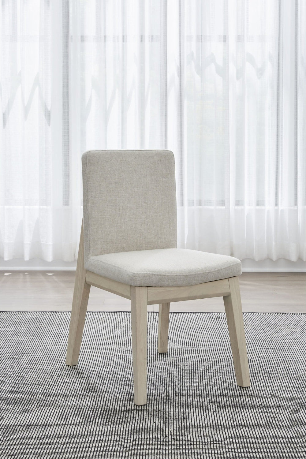 Liv Solid Wood Dining Chair in White Sand and Natural Linen — lifestyle photo