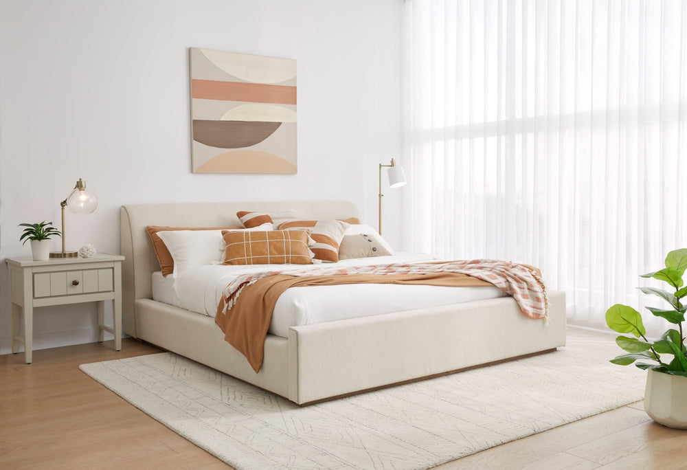 Louis Upholstered Platform Bed in Natural Linen styled in a bedroom