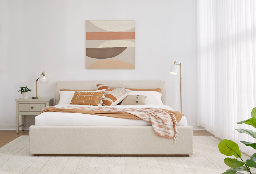 Louis Upholstered Platform Bed in Natural Linen styled in a bedroom