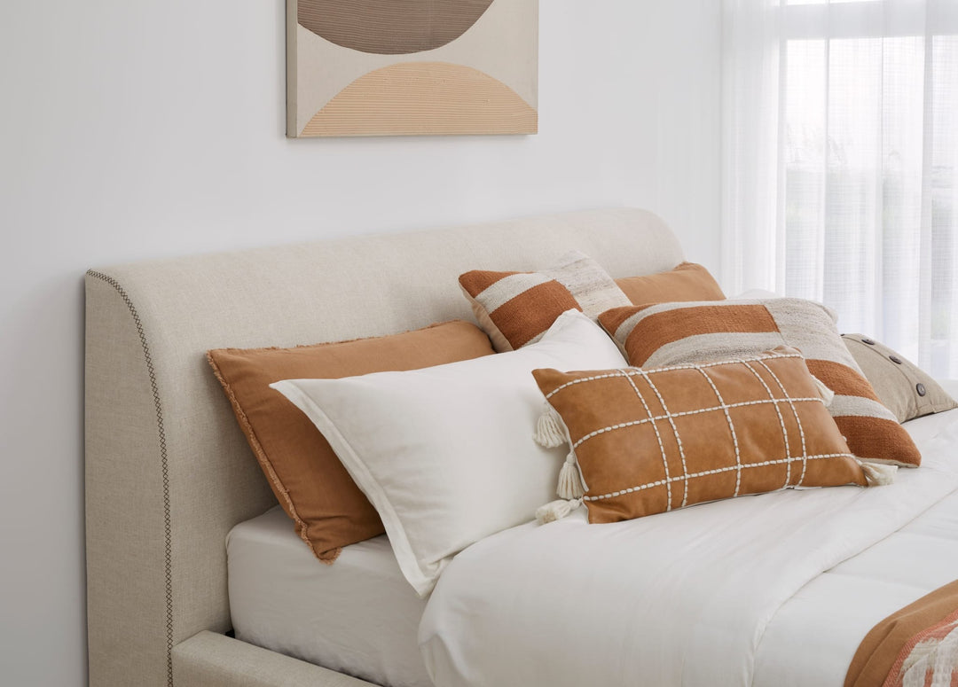 Louis Upholstered Platform Bed in Natural Linen styled in a bedroom