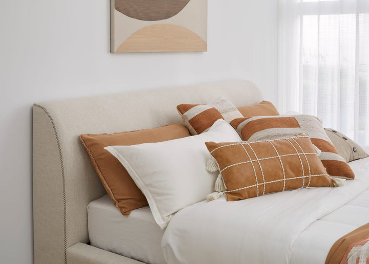 Louis Upholstered Platform Bed in Natural Linen styled in a bedroom