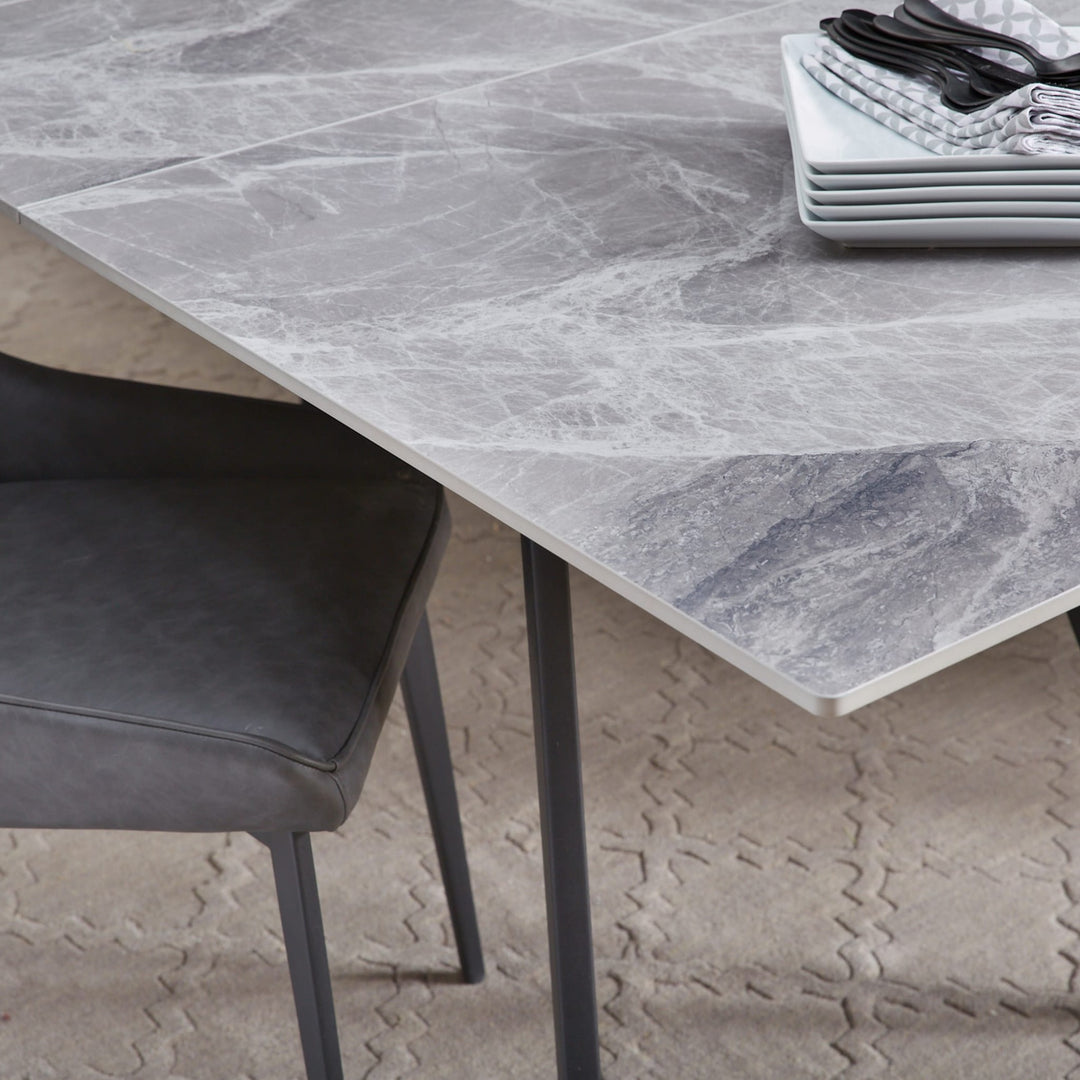 Lucia Extendable Stone Top Dining Table in Piedra and Black — lifestyle photo