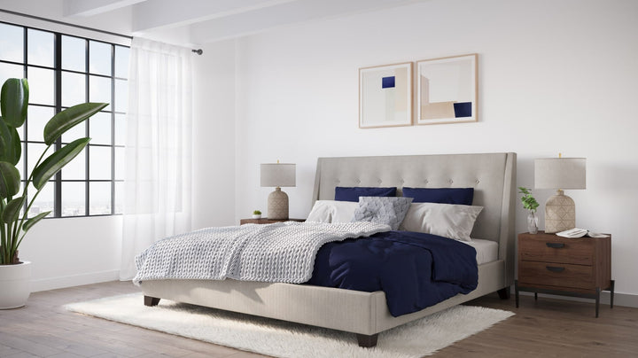 Madera Upholstered Platform Bed in Putty styled in a bedroom