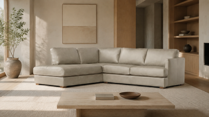 MALEA left-facing Light Stone leather sectional in a modern home