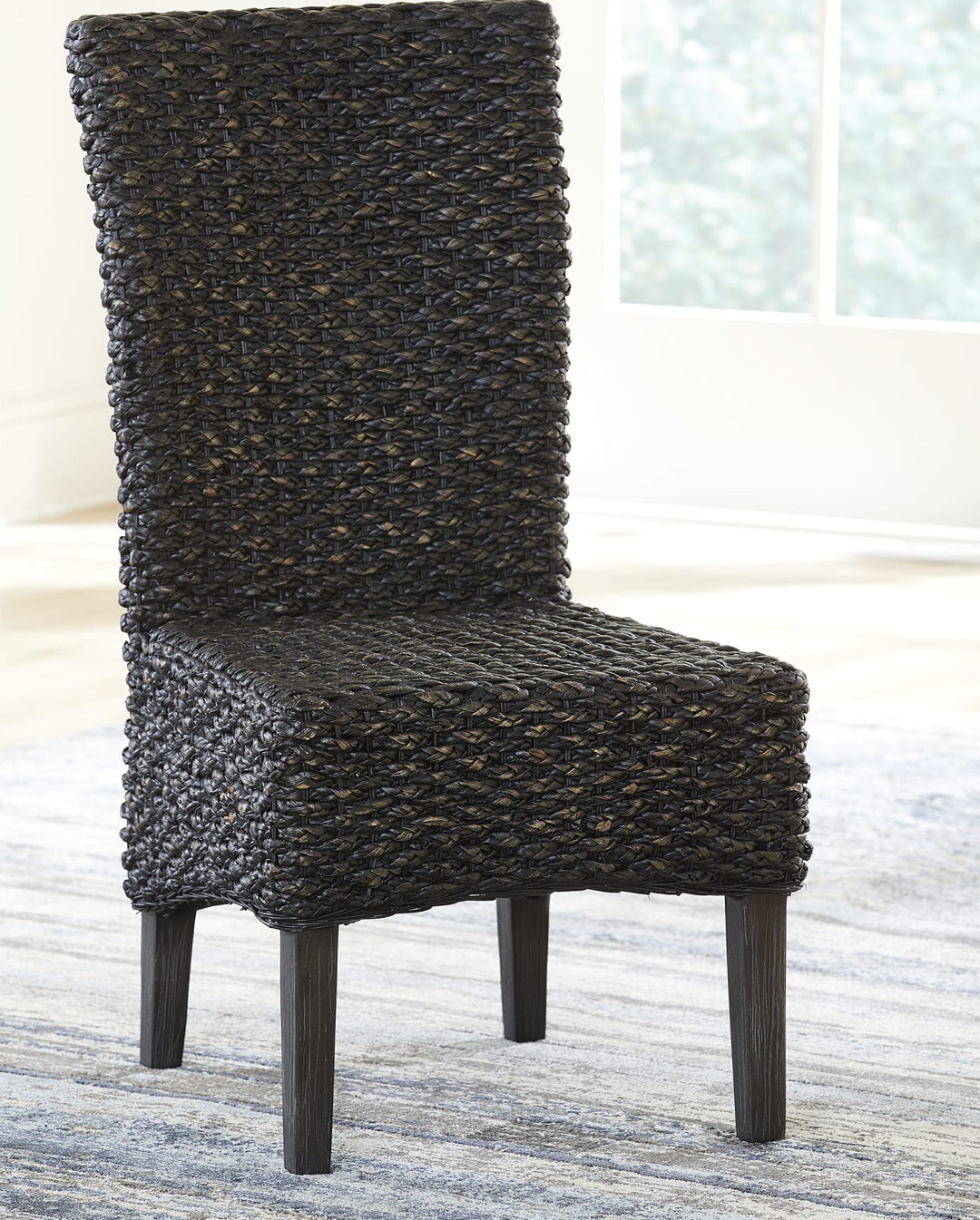 Meadow Wicker Dining Chair in Graphite — lifestyle photo