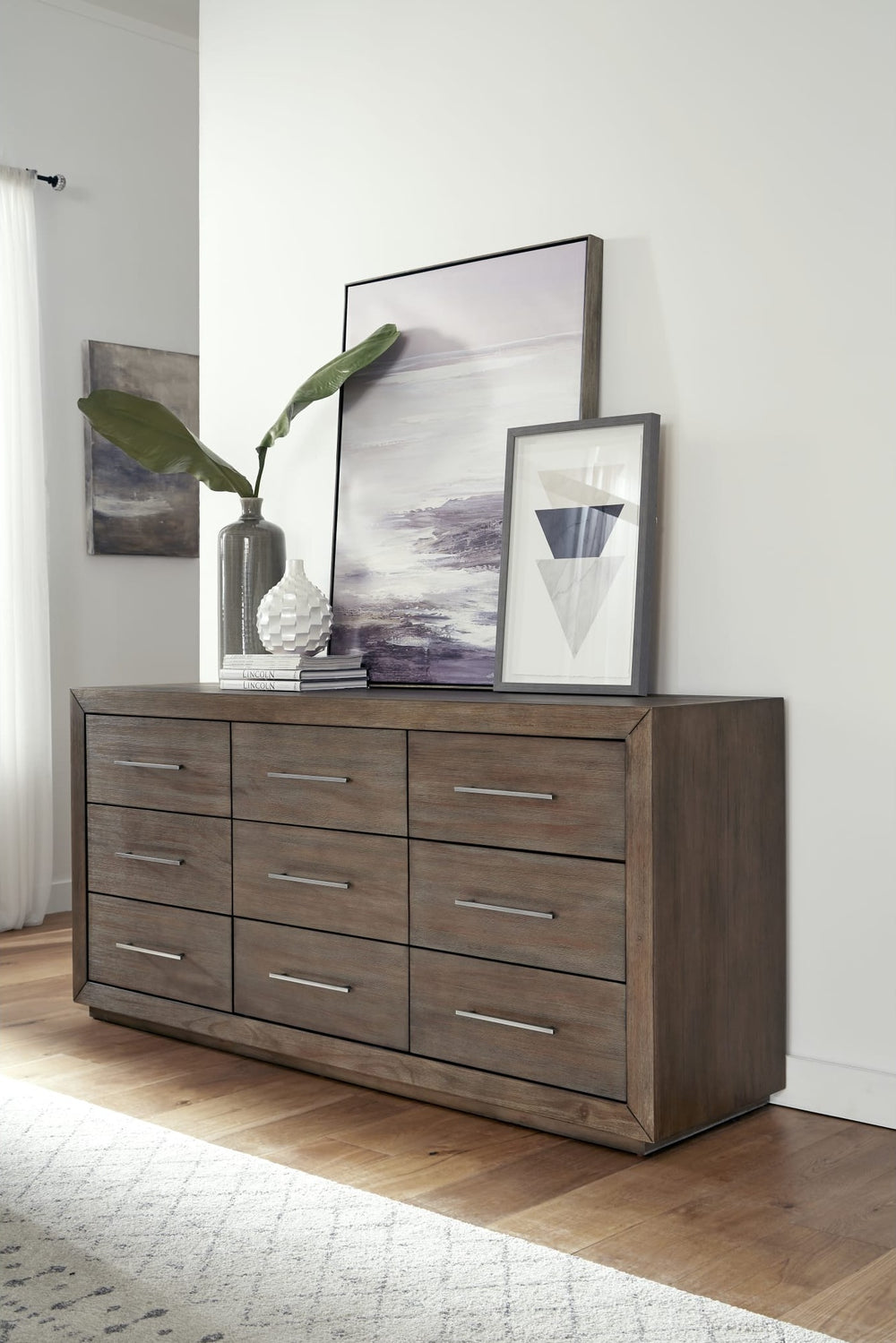Melbourne Nine Drawer Dresser in Dark Pine — styled in a room