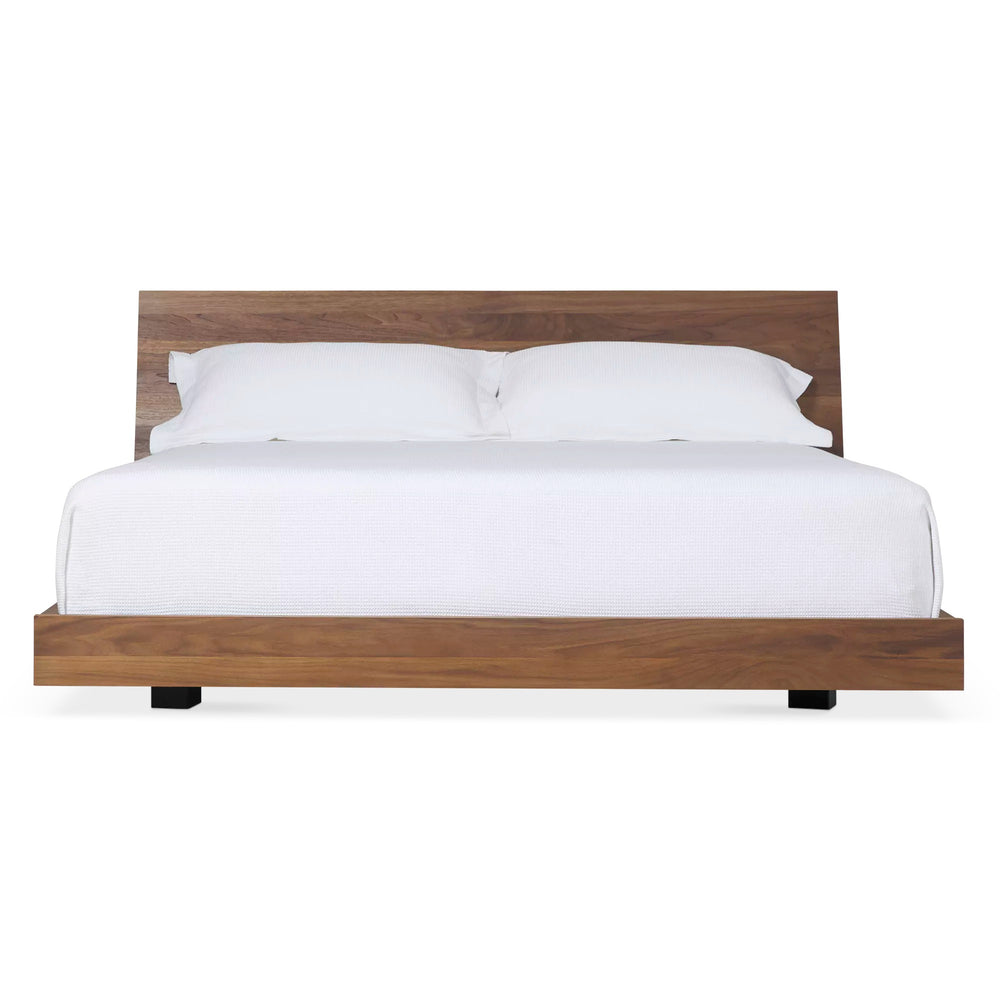 Mira Bed — front view, walnut