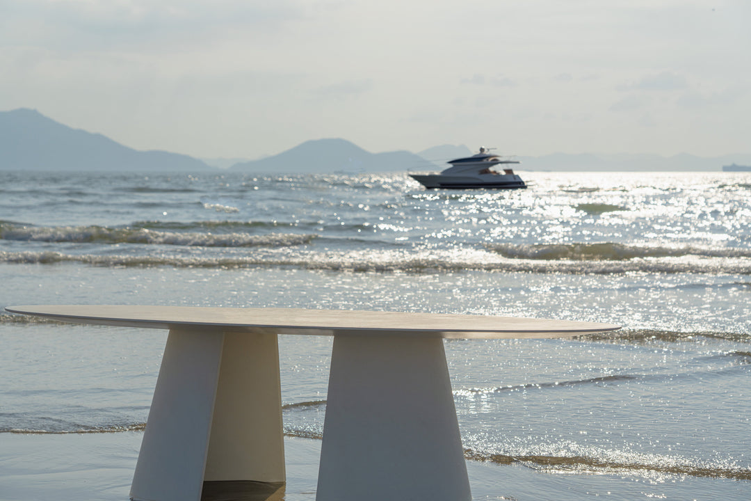 Mobital Tumuli oval outdoor dining table in Tapioca, alternate lifestyle view