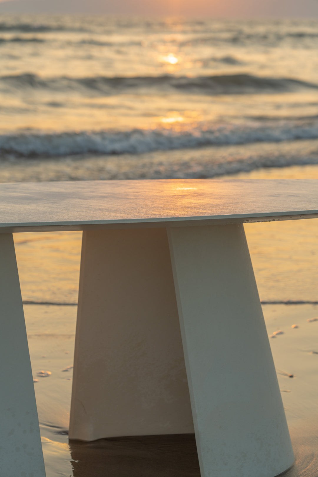 Mobital Tumuli oval outdoor dining table in Tapioca, side view