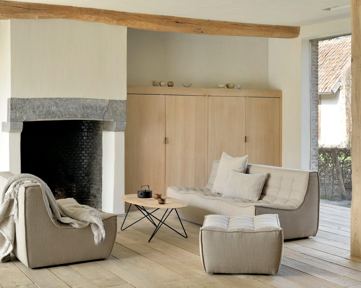 Ethnicraft lounge seating in a warm living room