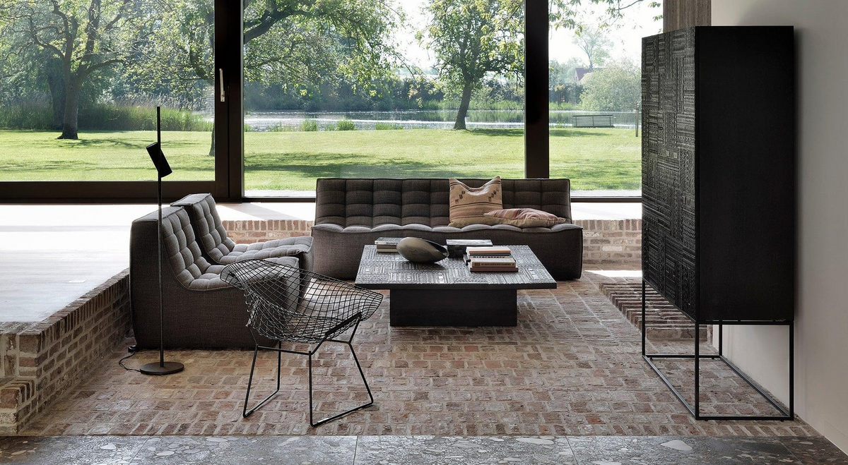 Dark grey modular sectional arranged in a contemporary living room