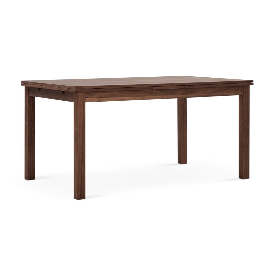 Naomi Dining Table — studio angle, walnut