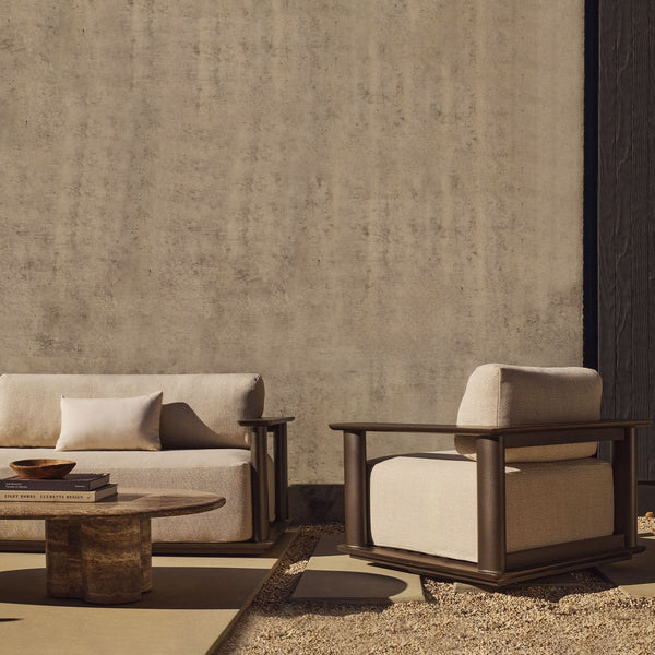 Harbour Outdoor sofa and lounge chair in a sunny patio setting