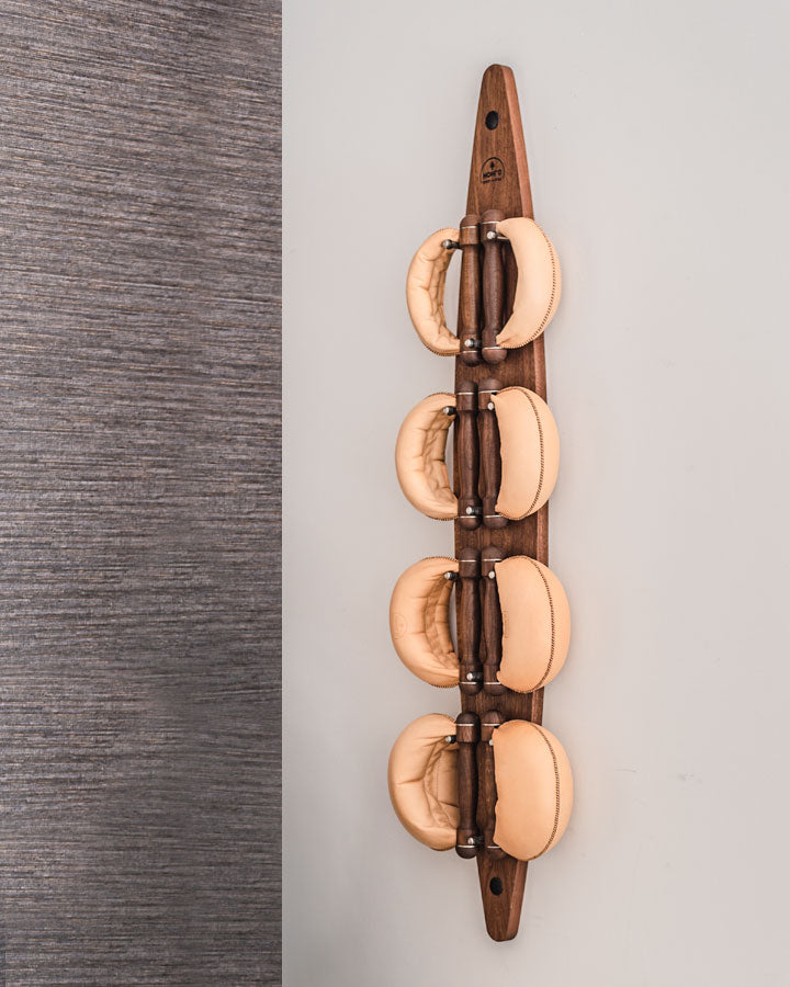 NOHRD SwingBells stored on the wall-mounted board