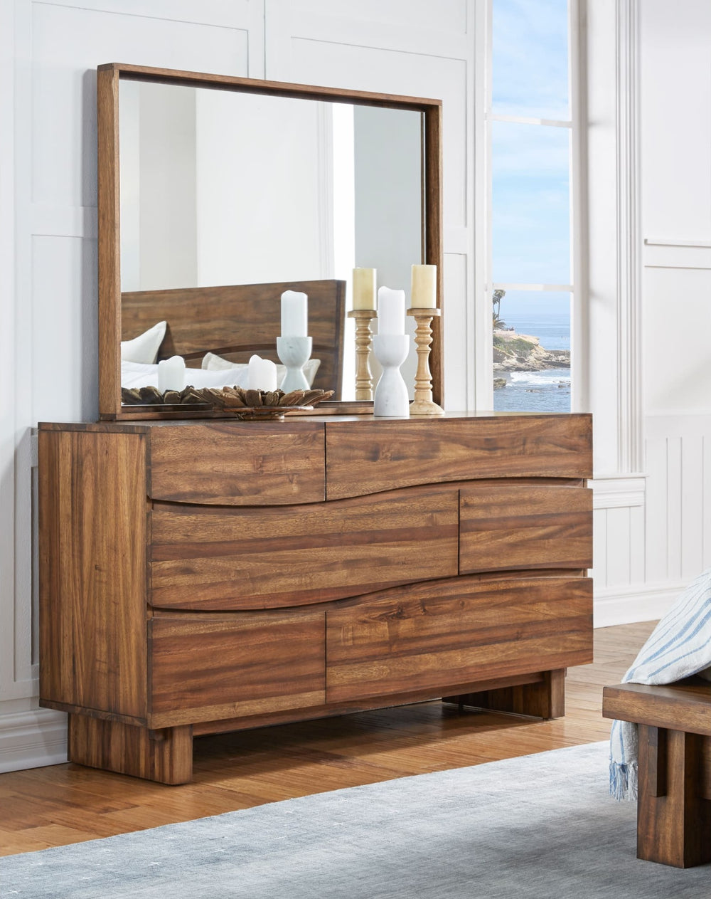 Ocean Six Drawer Solid Wood Dresser in Natural Sengon — styled with the matching mirror (sold separately)