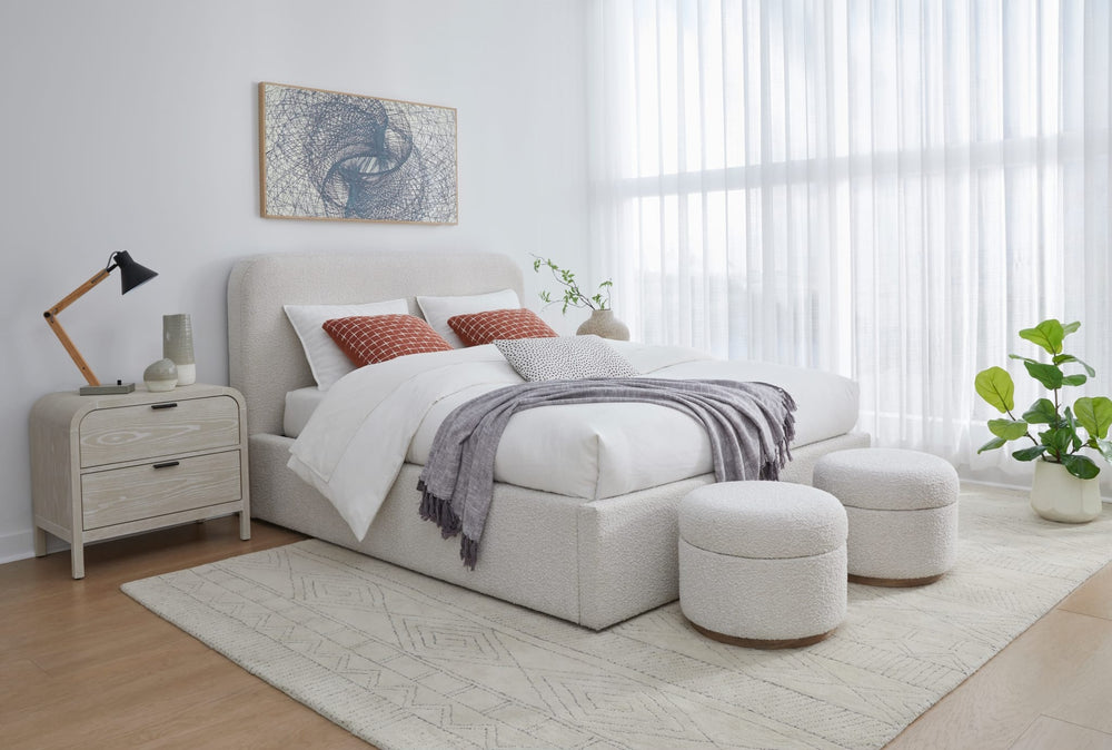 Off-White Upholstered Platform Bed in Ricotta Boucle styled in a bedroom