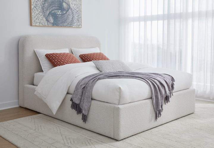 Off-White Upholstered Platform Bed in Ricotta Boucle styled in a bedroom