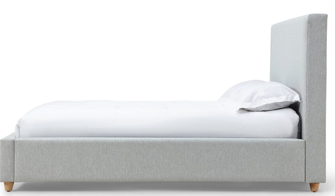 Olivia Upholstered Platform Bed in Linen — white background, side profile
