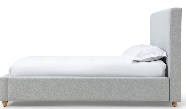 Olivia Upholstered Platform Bed in Linen — white background, side profile