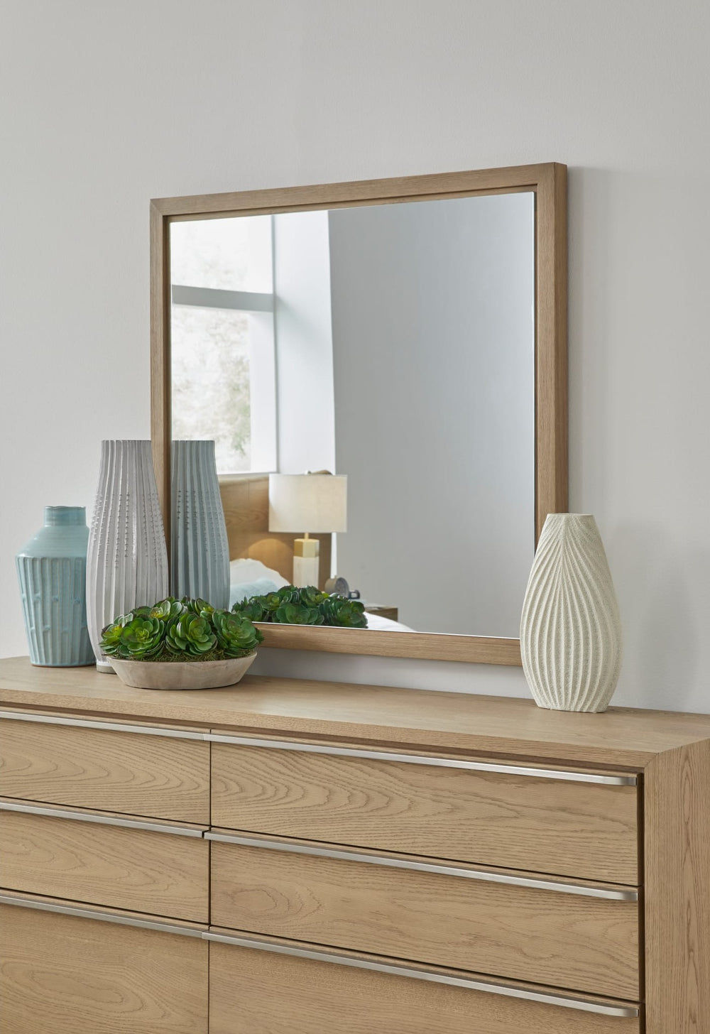 One Coastal Dresser Mirror in Bisque — styled on the matching dresser (sold separately)
